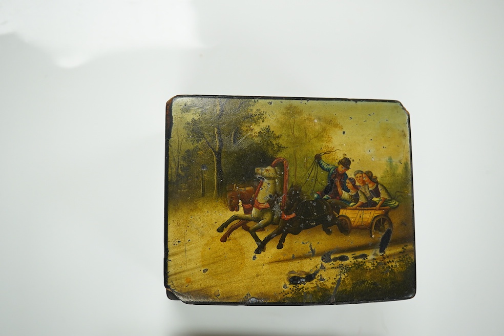 Four Russian lacquer boxes, late 19th/early 20th century, decorated with troika scenes, largest 12cm wide. Condition - fair